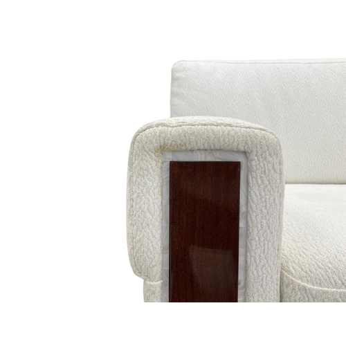 406 - ± Superyacht furnishings, a contemporary four/five seater sofa with white boucle fabric. On a highly... 