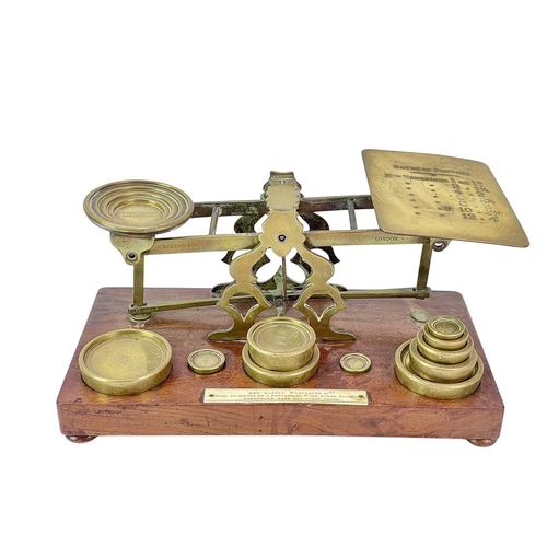 41 - A set Victorian of S. Mordan & Co brass and walnut postal scales. The brass weights fitted to four r... 