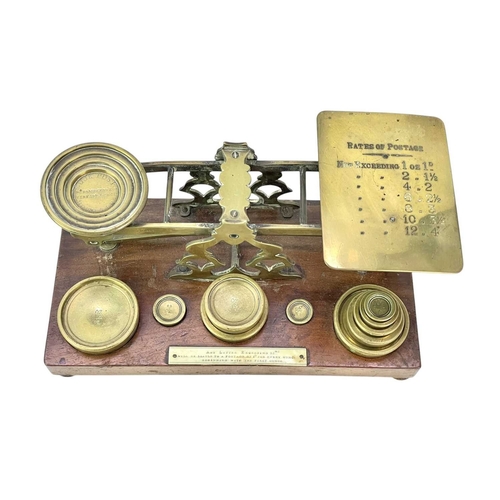 41 - A set Victorian of S. Mordan & Co brass and walnut postal scales. The brass weights fitted to four r... 