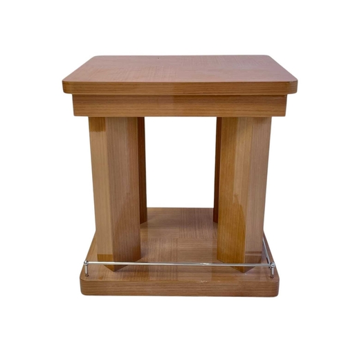 410 - ± Superyacht furnishings. Two contemporary laquered wood veneer side tables. Square table tops with ... 