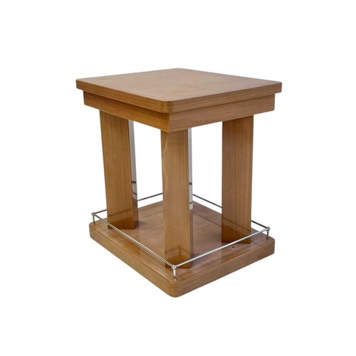 410 - ± Superyacht furnishings. Two contemporary laquered wood veneer side tables. Square table tops with ... 