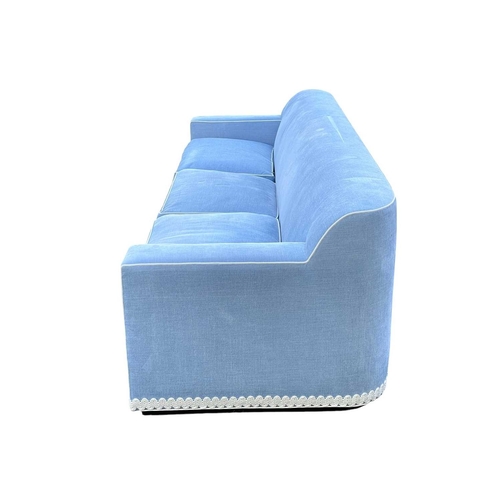 419 - ± Superyacht furnishings, a contemporary blue velour four/five seater sofa. Featuring a curved back ... 