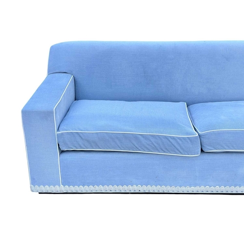 419 - ± Superyacht furnishings, a contemporary blue velour four/five seater sofa. Featuring a curved back ... 