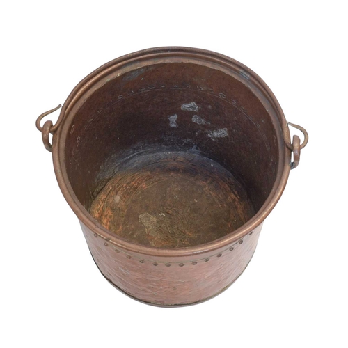 42 - A rivetted cylindrical copper coal or log bin. 19th century, with a wrought iron swing handle, heigh... 