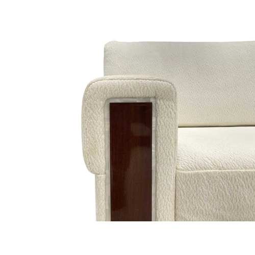 420 - ± Superyacht furnishings, a contemporary four/five seater sofa with white boucle fabric. On a highly... 