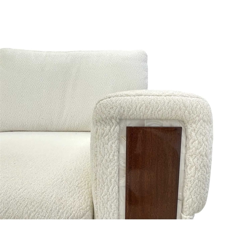 424 - ± Superyacht furnishings, a contemporary three/four seater sofa with white boucle fabric. On a highl... 