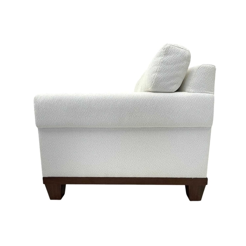 424 - ± Superyacht furnishings, a contemporary three/four seater sofa with white boucle fabric. On a highl... 