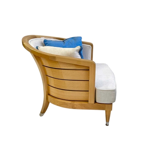 427 - ± Superyacht furnishings, a pair of upholstered chairs with curved backs. Laquered light wood veneer... 