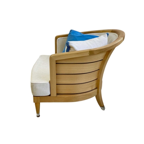 427 - ± Superyacht furnishings, a pair of upholstered chairs with curved backs. Laquered light wood veneer... 