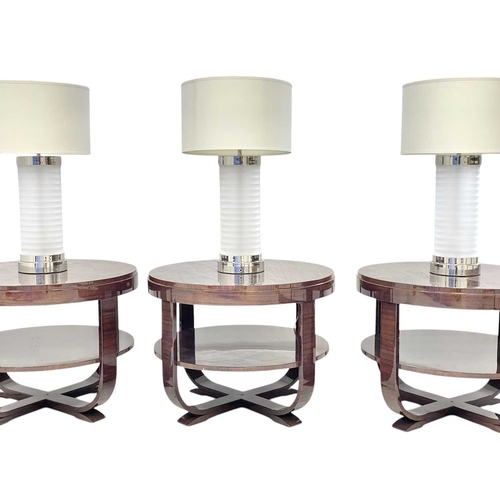 429 - ± Superyacht furnishings. Three circular side tables with integrated lamps. These contemporary table... 