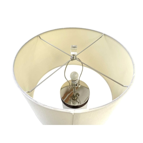 429 - ± Superyacht furnishings. Three circular side tables with integrated lamps. These contemporary table... 