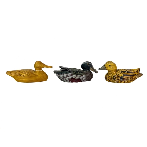 43 - A carved wood figure of a duck. Length 26cm, together with other wood, lacquered and resin figures o... 