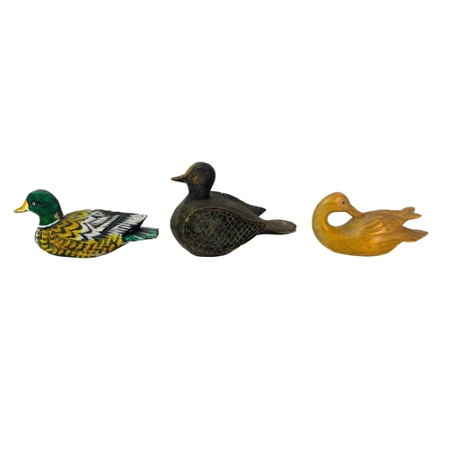 43 - A carved wood figure of a duck. Length 26cm, together with other wood, lacquered and resin figures o... 