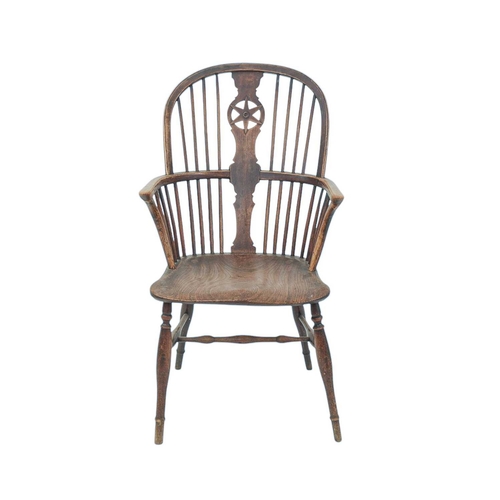 433 - An ash and elm Windsor armchair. 19th century, with pierced star back, solid seat and turned legs, h... 