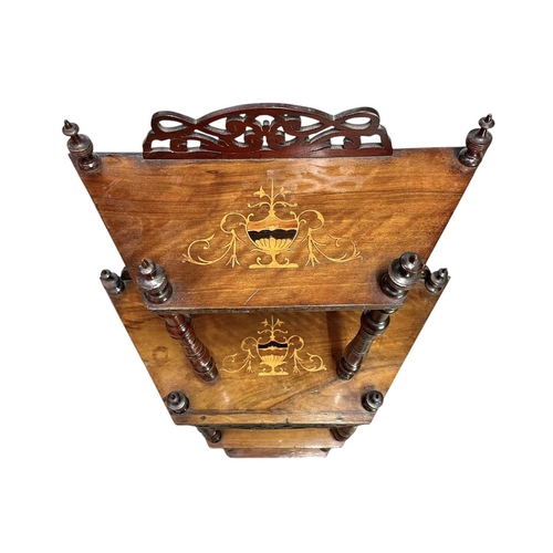 441 - A Victorian walnut and inlaid four-tier whatnot. The angled shelves with urn inlay, turned supports,... 