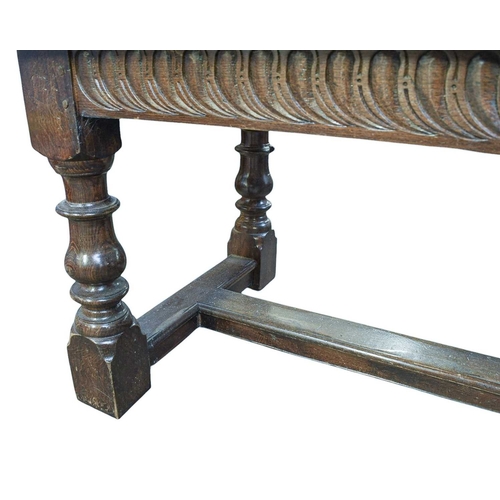 446 - An oak refectory dining table In the 17th century style, circa 1900, baluster turned square section ... 