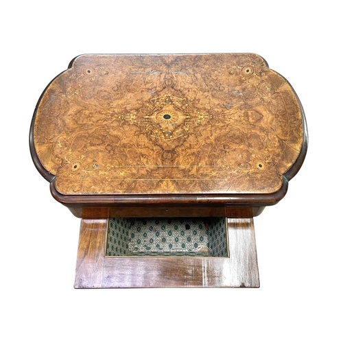 447 - A Victorian burr walnut games and sewing table. Folding swivel top, inlaid for chess, backgammon and... 