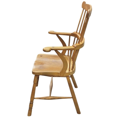 449 - A comb back ash and elm Windsor armchair by Peter Marshall. Circa 1960-70, stamped mark and monogram... 