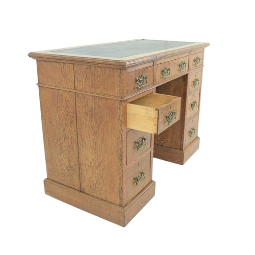 456 - A late Victorian oak twin pedestal desk. Fitted with nine drawers on a plinth base, height 80cm, 107... 