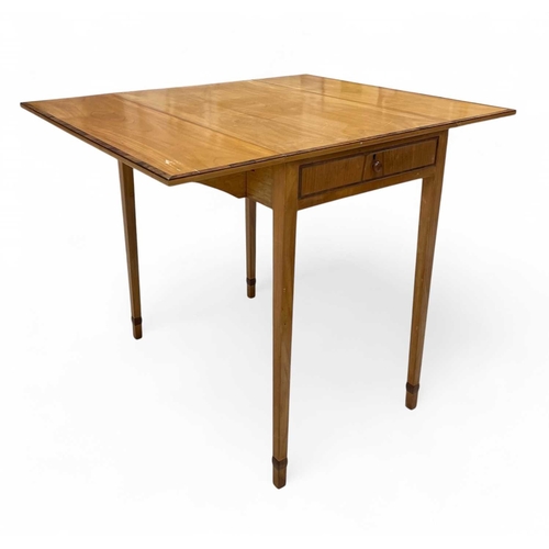 464 - A contemporary cherry and walnut Pembroke table, in the Arts and Crafts tradition. Fitted with an en... 