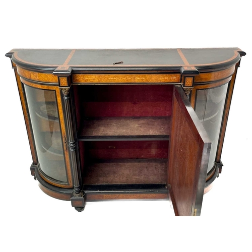 465 - A Victorian ebonised, amboyna banded, and gilt metal mounted credenza. The panel door inset an oval ... 