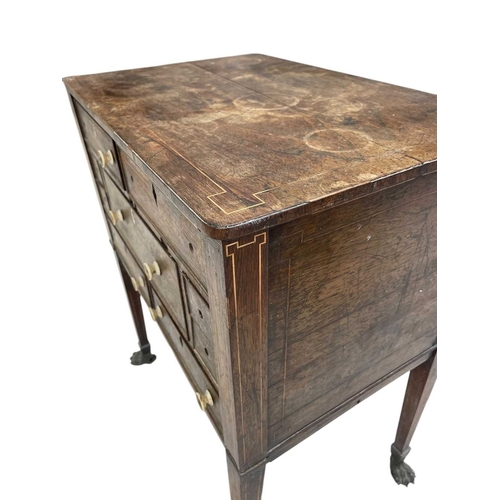 466 - A remarkable Regency rosewood toilet and work table. With boxwood stringing and fitted an arrangemen... 