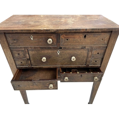 466 - A remarkable Regency rosewood toilet and work table. With boxwood stringing and fitted an arrangemen... 