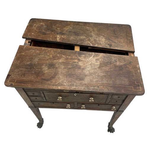 466 - A remarkable Regency rosewood toilet and work table. With boxwood stringing and fitted an arrangemen... 