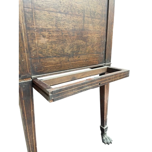 466 - A remarkable Regency rosewood toilet and work table. With boxwood stringing and fitted an arrangemen... 