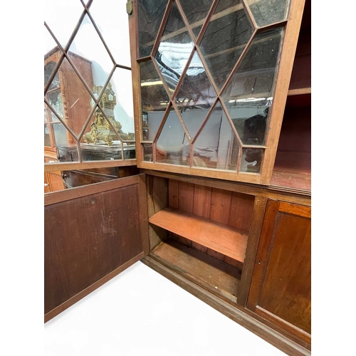 471 - A mahogany bookcase cabinet. George III, but later adapted and altered, with a removable cornice abo... 