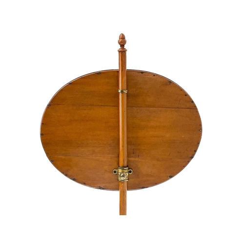 478 - A Regency style satinwood pole screen. Circa 1890, in the Sheraton taste, the oval banner set a buco... 