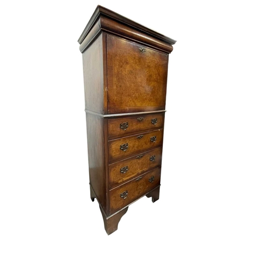 483 - A walnut veneered tallboy chest. 20th century, in the early 18th century style, with a cushion friez... 