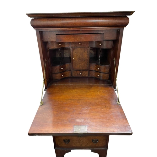 483 - A walnut veneered tallboy chest. 20th century, in the early 18th century style, with a cushion friez... 