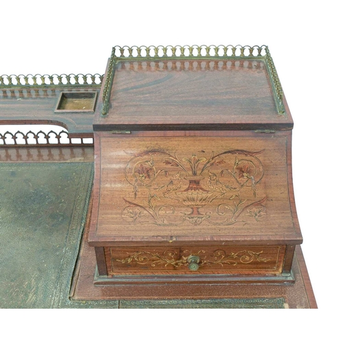 484 - A late Victorian mahogany and inlaid writing desk. The galleried superstructure with lift front comp... 