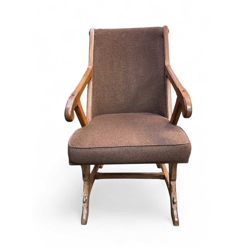 486 - An Arts and Crafts walnut armchair. With pegged X frame support, originally with caned seat, height ... 