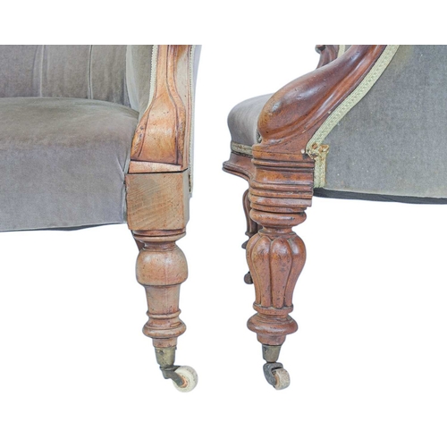 487 - An early Victorian mahogany spoon back chair, and another similar. With button back upholstery, scro... 