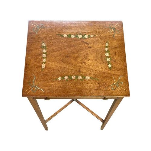 492 - An Edwardian painted mahogany side table. The top with ribbon tied floral garlands, above a single d... 