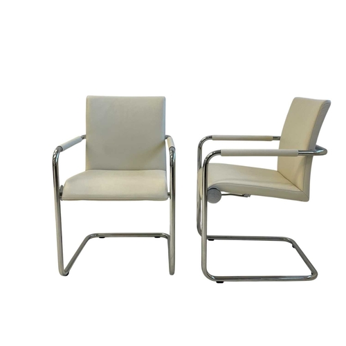 494 - Six Hulsta white leather dining chairs. Chrome tubular frames, white leather upholstered seats and a... 