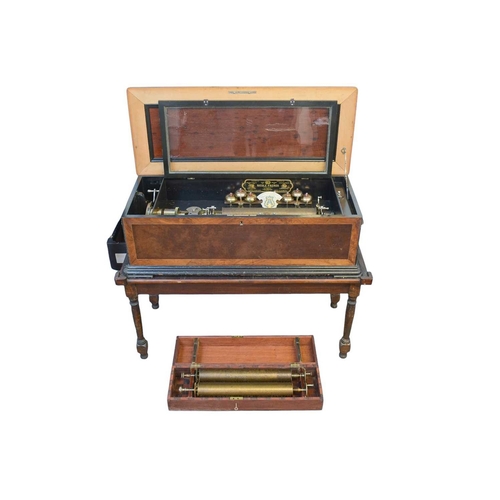 50 - A Nicole Freres figured walnut and banded cylinder music box on a stand. Late 19th century, stamped ... 