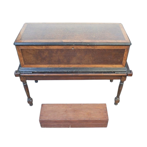 50 - A Nicole Freres figured walnut and banded cylinder music box on a stand. Late 19th century, stamped ... 