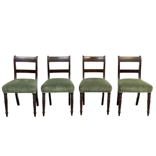 504 - A set of eight George IV mahogany dining chairs. With bar backs, reeded uprights, and stuffover upho... 