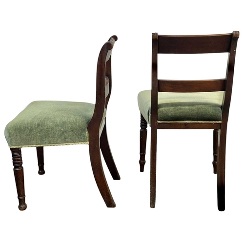 504 - A set of eight George IV mahogany dining chairs. With bar backs, reeded uprights, and stuffover upho... 