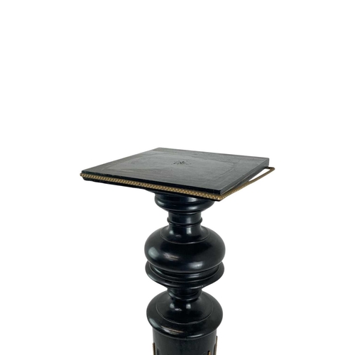 506 - A Victorian ebonised torchere. With a gilt metal mounted fluted column, on a square base, height 107... 