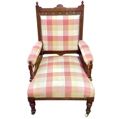 508 - A Victorian walnut framed armchair, in the Manner of E W Godwin. With blind carved and incised decor... 