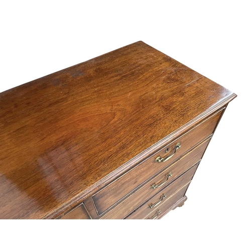 512 - A late George III mahogany chest. Fitted two short and three long drawers on ogee bracket feet, heig... 