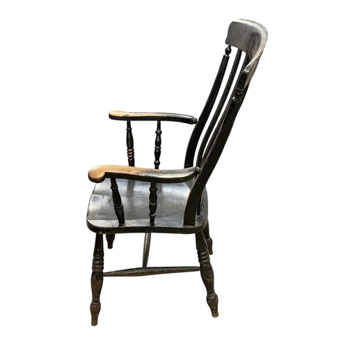 513 - A painted beech and ash kitchen Windsor armchair. With a lath back, solid seat on turned legs, heigh... 