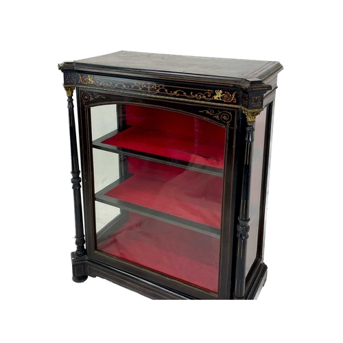 514 - A 19th century ebonised, inlaid and gilt metal mounted side cabinet. With a glazed door and sides, p... 