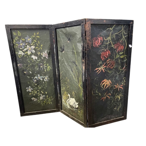 515 - A folding screen with handpainted floral decoration. Three canvas panels, black painted wood surroun... 