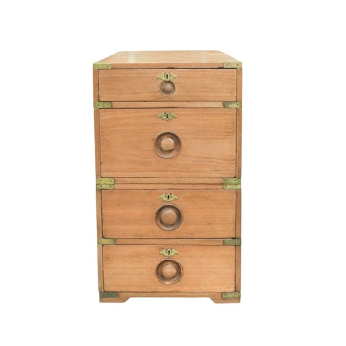 518 - A teak campaign style two-part chest. Circa 1900, with brass angles and mounts and recessed turned k... 