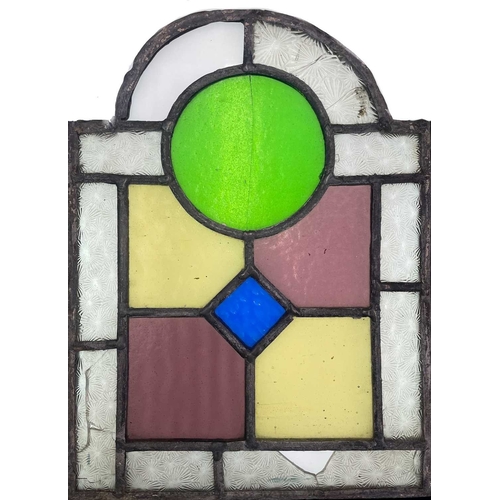 52 - A group of three Edwardian arched stained and leaded glass panels. 1: Each 31X23cm, together with a ... 